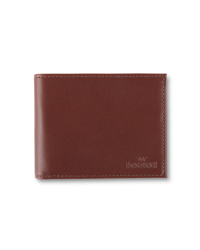 A brown leather wallet with meticulous stitching around the edges and the brand name ‘KING RANCH’ embossed in the lower right corner, set against a white background.