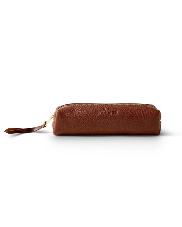 A brown leather pencil case with ‘KING RANCH’ embossed on the side, featuring a zipper with a leather pull tab, presented against a white background.