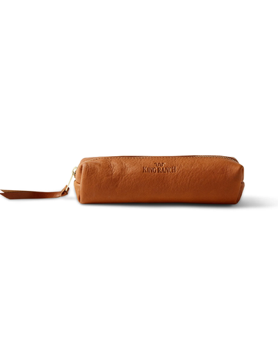 A light brown leather pencil case with ‘KING RANCH’ embossed on the side, featuring a zipper with a leather pull tab, presented against a white background.