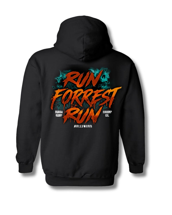 A black pullover hoodie shown from the back, featuring a large graphic print with the words 'RUN FORREST RUN' in orange and red distressed lettering, with teal splatter details and smaller white text reading 'HOLLYWOOD' on a white background.