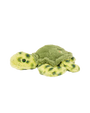 A sideview of a green turtle plush toy with dark green spots on the body and green eyes laying against a plain background, including a circular emblem on the back of the shell.