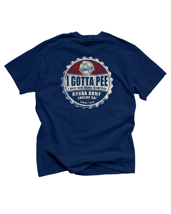 A backside view of a navy-blue crewneck T-shirt with a blue bottle cap in red, white and blue reading " I gotta Pee, i must have drank 15 bottle" and bottom part reads "bubba gump shrimp co since 1975". The background is plain white.