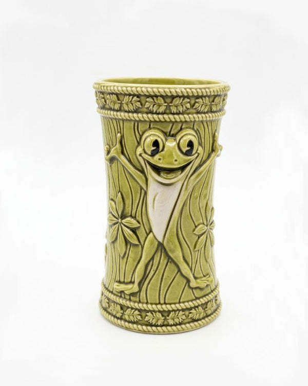 Decorative vase with a smiling face design on a white background