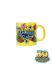 A vibrant yellow mug from Rainforest Cafe featuring colorful floral designs and the cafe’s logo on the back. The mug commemorates ‘30 WILD YEARS!’ with a tree frog coming out the 0.