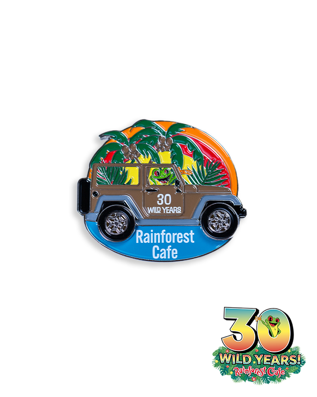 A colorful car magnet featuring a stylized vintage car adorned with tropical foliage and a green frog peeking out from the driver’s seat. The car displays the ‘Rainforest Cafe’ logo on a blue banner, and below it, text celebrates ‘30 WILD YEARS!’ of Rainforest Cafe with a frog sticking out the 0.