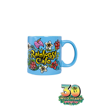 A bright blue ceramic mug with a handle on the right side, adorned with colorful floral illustrations and the bold yellow ‘Rainforest Cafe’ logo outlined in green. Below the mug, the ‘30 WILD YEARS! Rainforest Cafe’ logo features tropical foliage, celebrating the cafe’s anniversary. The mug’s vibrant design stands out against the plain white background.