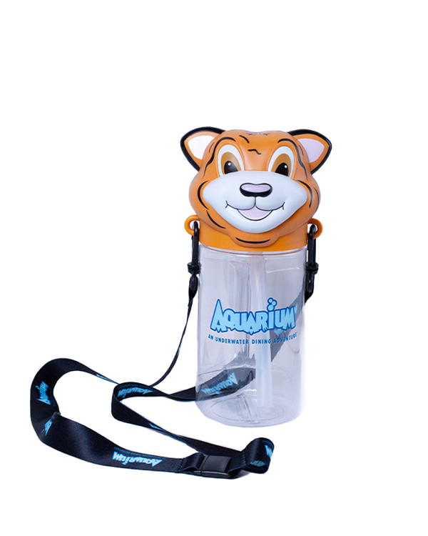 A clear cylindrical water bottle with a blue "AQUARIUM, AN UNDERWATER DINING ADVENTURE", in the center, tiger head lid, and a black lanyard attached with blue text along it. The background is plain white.