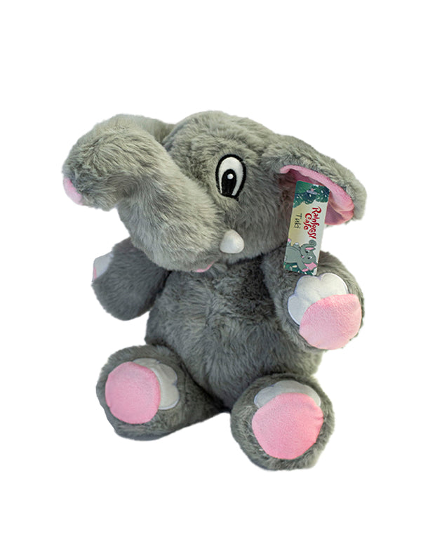 Side view of Tuki the Elephant plush in front of white background.