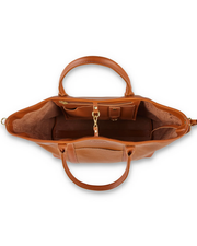 A top-down view of an open, empty brown leather handbag, revealing a smooth exterior, a suede interior with various compartments, and a golden clasp for secure closure.