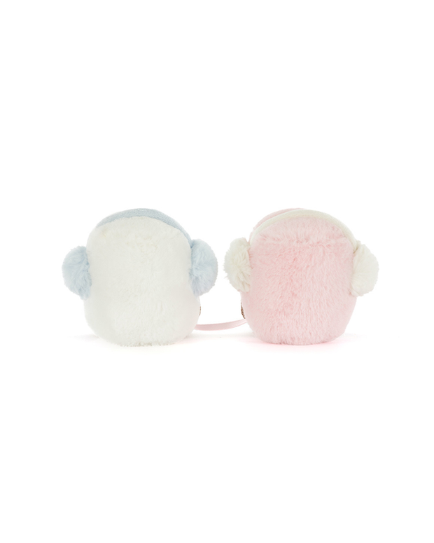Back view of two marshmallow plush toys, one pink and one white, with brown feet, earmuffs on and on a white background