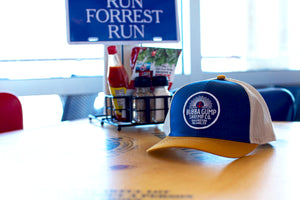 Ancor tucker Bubba Gump hat is on the table in the Bubba Gump restaurant. 
