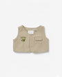 Beige vest with 'SAFARI' and paw print design on a white background