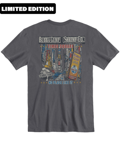 'limited edition' sign at the right of the image. Back of a grey t-shirt featuring a graphic print. The print shows an urban scene with buildings and signage, including the words “BUBBA GUMP SHRIMP CO.” and “TIMES SQUARE” prominently displayed. Below the urban imagery, text reads “NO PLACE LIKE IT.” This design gives the impression of a bustling city atmosphere associated with Times Square in New York City, known for its connection to the Bubba Gump Shrimp Company restaurant chain.