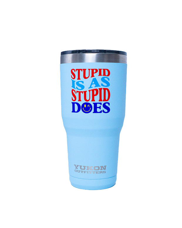 A blue tumbler with a tapered design, featuring a red and blue text overlay that reads ‘STUPID IS AS STUPID DOES’ in capital letters. The brand ‘YUKON OUTFITTERS’ is printed at the bottom in silver font. 