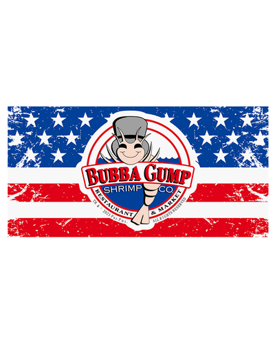 Towel with a graphic featuring the Bubba Gump Shrimp Co. logo superimposed on a distressed American flag background. The logo includes an illustration of Shrimp Louis along with the text ‘BUBBA GUMP SHRIMP CO RESTAURANT & MARKET’  in red, black and white.