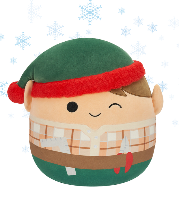 The image features a plush elf toy wearing winter attire, complete with a green hat and red earmuffs. The character has a simplistic face with one closed eye and a black dot for a nose.