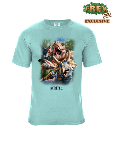 Light blue t-shirt with a vibrant graphic print on the front, showcasing various dinosaurs such as a T-Rex and Triceratops in dynamic poses, set against a blurred greenish backdrop. Below the illustration, the word “T-REX” is prominently displayed in bold, capital letters. The design is detailed, highlighting the scales, teeth, and other features of the dinosaurs. Top right corner of image shows the text “T-REX CAFE EXCLUSIVE” is displayed above the graphic, while the word “Exclusive” is seen below.