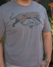 close up image of person wearing grey t-shirt with a graphic of a tiger and the prhase "Easy Tiger" printed on it.