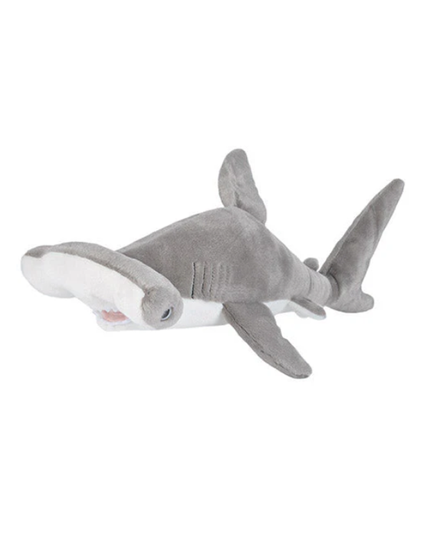 A child-friendly plush toy designed to resemble a hammerhead shark, featuring a distinctive flat head with eyes on the ends, and a soft gray body with a lighter underbelly. The toy is set against a plain background, highlighting its cuddly appearance and the unique shape of the marine animal it represents