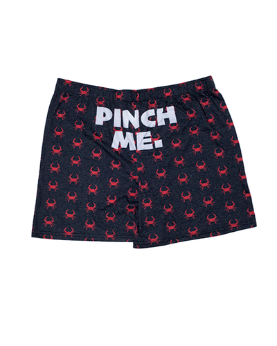 back view of boxers. center reads in white words "pinch me".
