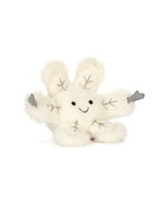 Plush toy snowflake with hands on a white background