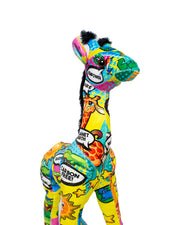 close up of giraffe plush with colorful comic patterns containing message bubbles and safari animals 