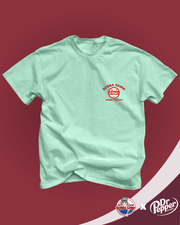 Bubba Gump and Dr. Pepper collaboration. Mint green t-shirt with a vintage Dr. Pepper logo  and 'Bubba Gump Shrimp Company' written  on the top left chest area.
