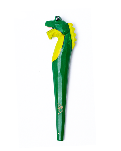 wood carved pen in shape of Iggy the Iguana. top of pen is Iggy's face, and the body on the rest of the pen in a green color.