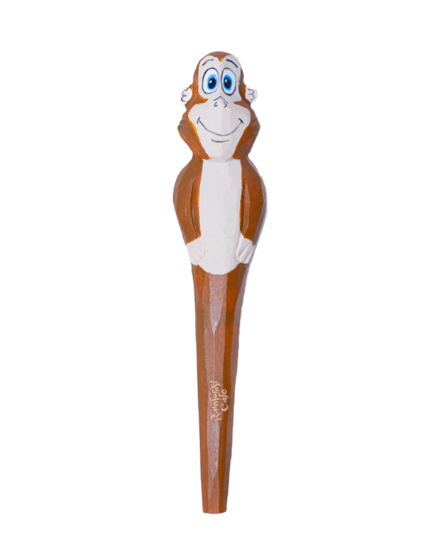 A whimsical character pen with the top shaped like a smiling orangutan with big blue eyes, brown and white fur, and arms crossed. The body of the pen is elongated, maintaining the brown color of the monkey’s fur, and it appears to have some text inscribed at the bottom, although it’s not clearly visible.