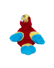 Back view of Red Macaw plush. Beak, feet and head feathers are a yellow color. Her wings and tail go from red, to yellow and then blue tips. Rio the macaw is wearing a little white flower on her head.