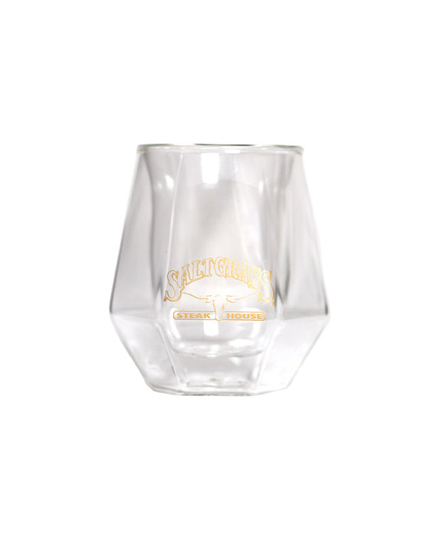 Hexagonal-shaped whisky glass embroidered with the Saltgrass logo in a gold font.