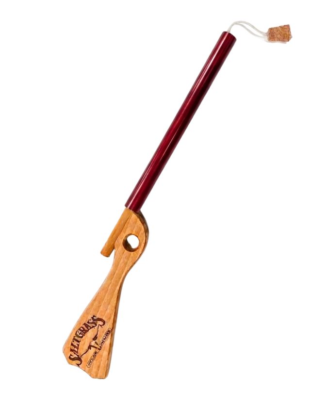 Wooden and red tool with cork on a white background