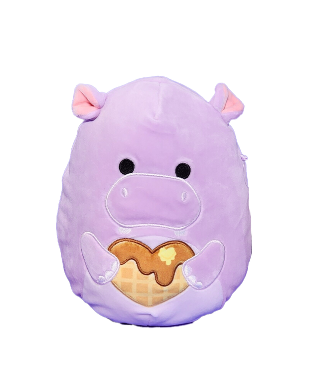 A plush toy shaped like a purple hippo with a joyful expression, holding a heart shaped waffle.
