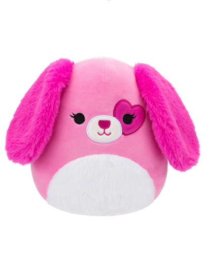 A plush toy dog with soft pink fur and floppy ears, featuring a white snout and a dark pink heart-shaped around one eye.