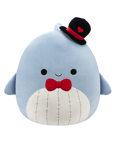 A new plush toy resembling a cheerful blue whale, complete with a smiling face, a red bow tie, and a black hat adorned with a heart.