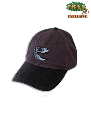 Dark two-tone cap with embroidered dinosaur skull on front and black "New" label in corner.