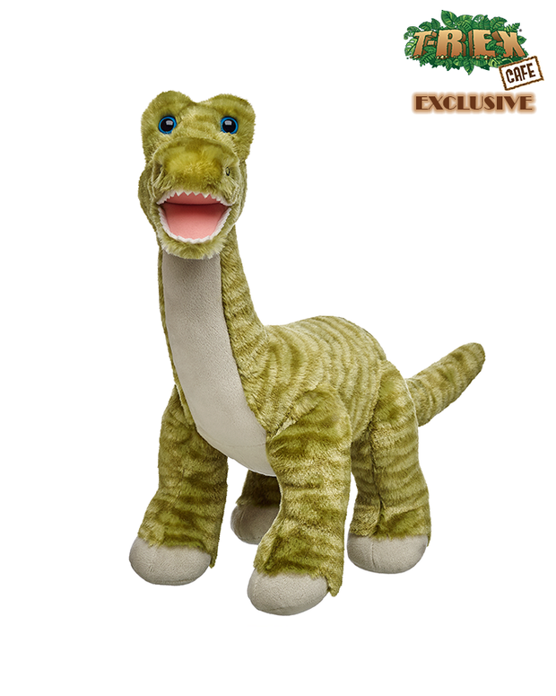 The plush toy appears to be predominantly green with bright blue eyes and an open mouth displaying white teeth. Its body is covered in soft, green fabric with darker green stripes and wrinkles to mimic the texture of skin. The T-Rex is standing on its two hind legs, and its two small front limbs are visible. Above the T-Rex, there’s text indicating that this is an exclusive item from “T-REX CAFE.