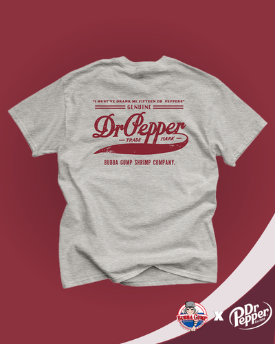 Dr. Pepper and Bubba Gump collaboration. Back view of grey t-shirt with a vintage Dr. Pepper logo printed on the back. The text reads a quote from Forest Gump "I must've drank me fifteen Dr. Peppers" and includes 'Bubba Gump Shrimp Company' at the bottom of the Dr. Pepper logo.
