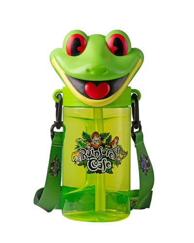 A vibrant children’s drink container designed to resemble a smiling green frog, featuring big red eyes and a wide smile.  The ‘Rainforest Cafe’ logo surrounded by jungle foliage and animal illustrations. It has adjustable green straps for easy carrying.