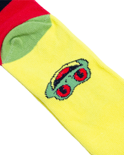close up of bottom of sock with cha cha the tree frog face.