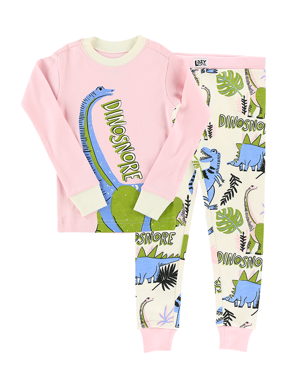 A cozy children’s pajama set with a pink long-sleeve top showcasing a large, colorful dinosaur graphic and the playful word ‘DINOSNORE’, paired with white pants adorned with a vibrant pattern of various dinosaurs and green foliage.