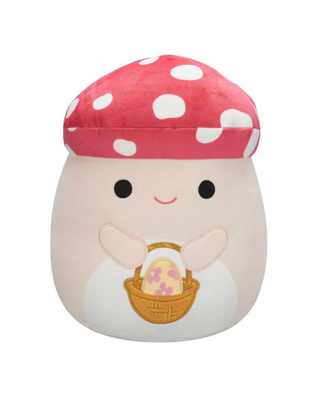 A cute plush mushroom character with a pink spotted cap, smiling and holding a woven basket containing a colorful Easter egg.