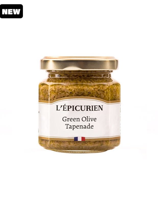glass jar with green olive tapenade and golden lid.