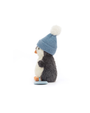 Stuffed penguin toy wearing a blue knitted hat on a white background