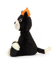 A sideview of a black cat plush sitting against a white background, with a white belly and snout, and an orange beanie hat.