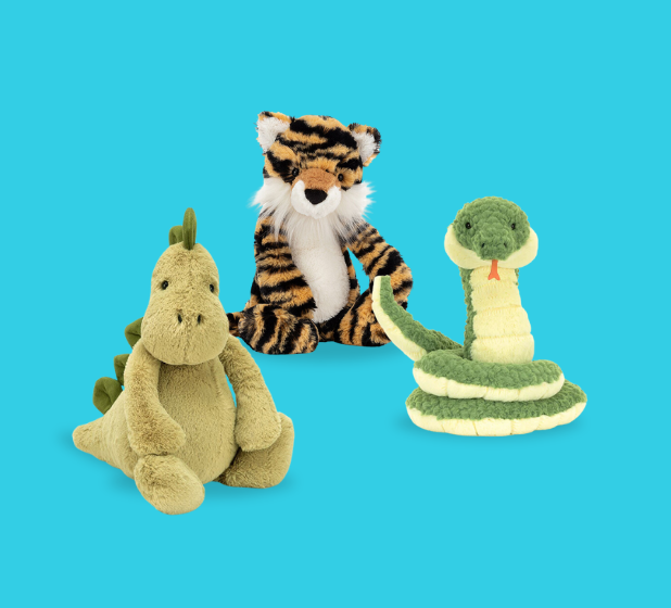 Three colorful stuffed animals: a green dinosaur, a striped tiger, and a coiled green snake, set against a bright blue background.