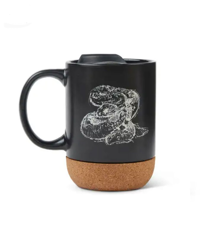 Black travel mug with cork bottom and white rattlesnack design.