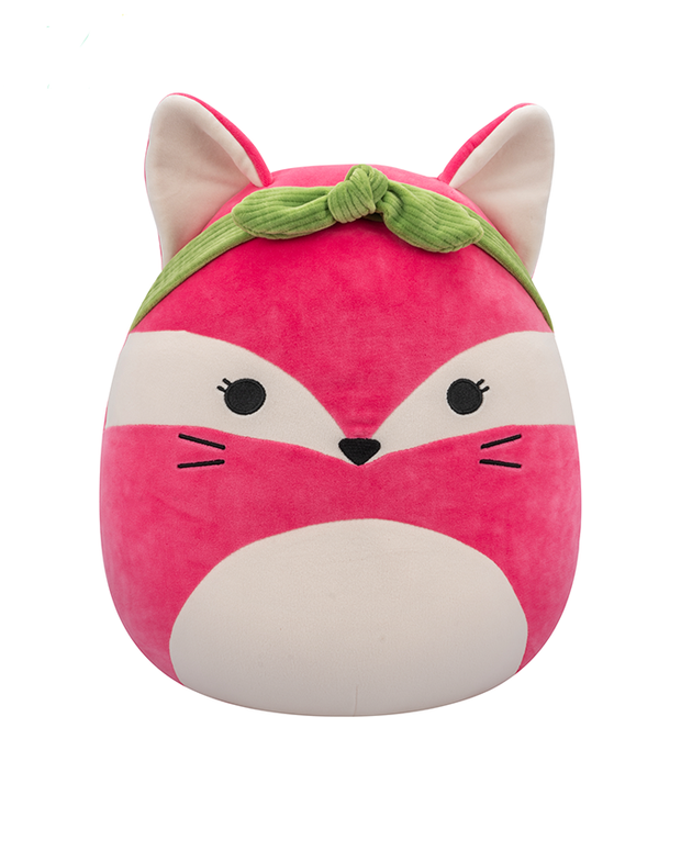 The image features a plush toy shaped like a fox, with a pink and white face, black stitched features, and a green headband on top. The ears are pointed with pink outlines, and the simple stitched eyes, nose, and whiskers give it a charming expression. 