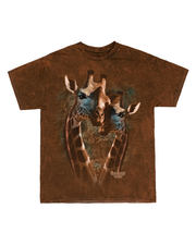 a brown t-shirt with a unique graphic print. It depicts two giraffes facing forward with their necks crossing each other, forming a heart shape between them. The background is a darker shade of brown, and there’s a signature at the bottom right corner of the print.