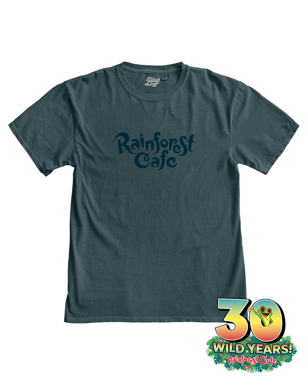 A teal t-shirt with the ‘Rainforest Cafe’ logo in blue text on the front. On bottom right of image colorful emblem that celebrates ‘30 Wild Years!’ with vibrant colors, and a tree frog coming out the zero.